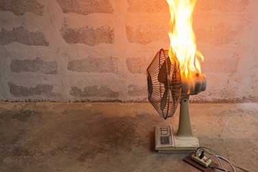 A household fan catches on fire because of a manufacturing defect. 