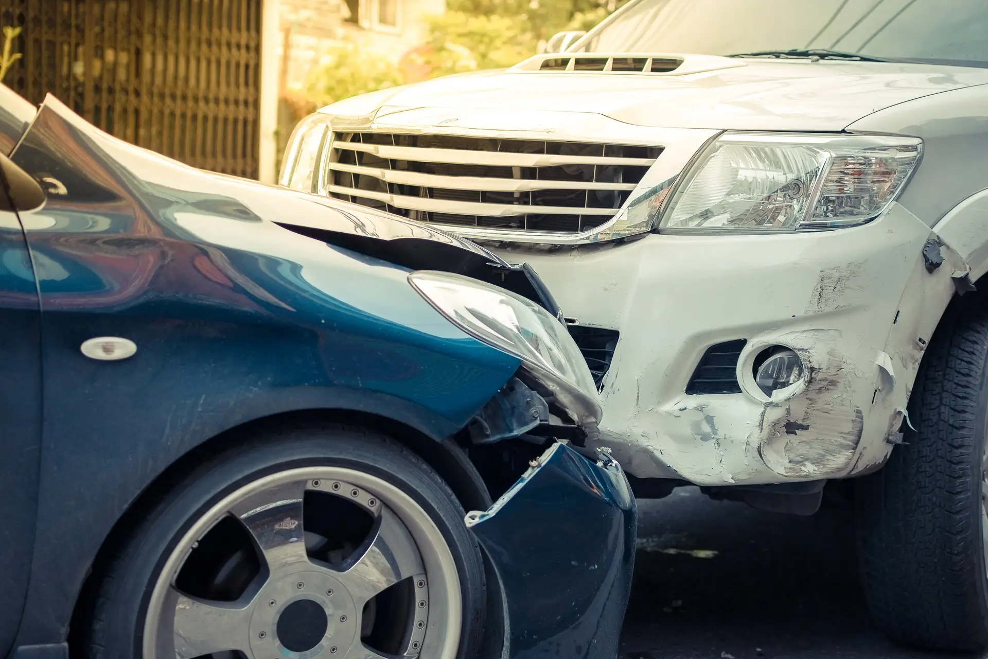 A close-up look at the front-end damage done to two vehicles after a head-on collision.