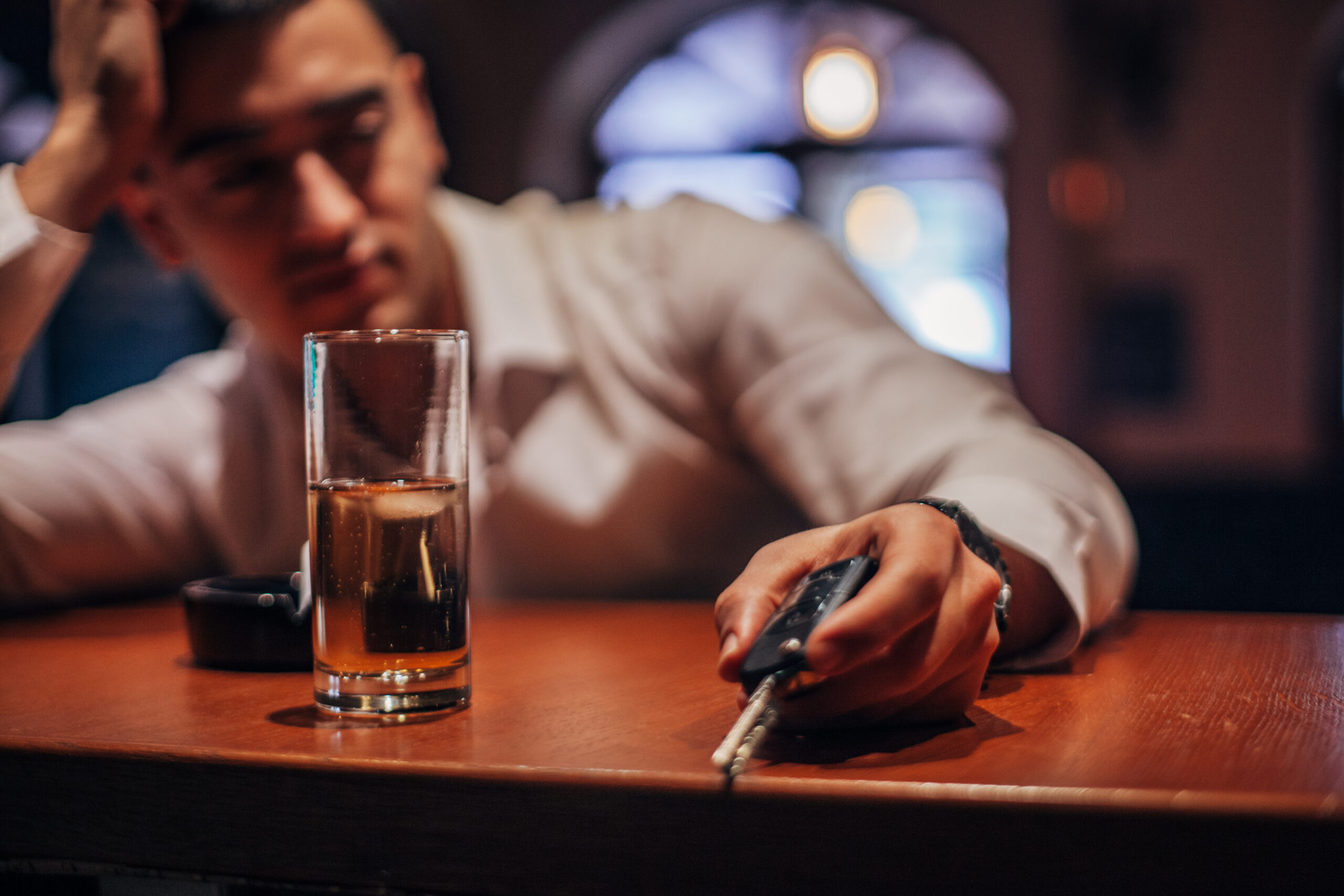 Drunk man holding car keys