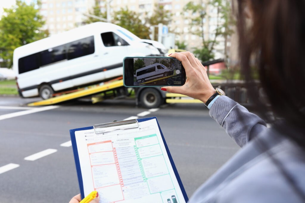 women taking picture of vehicle 