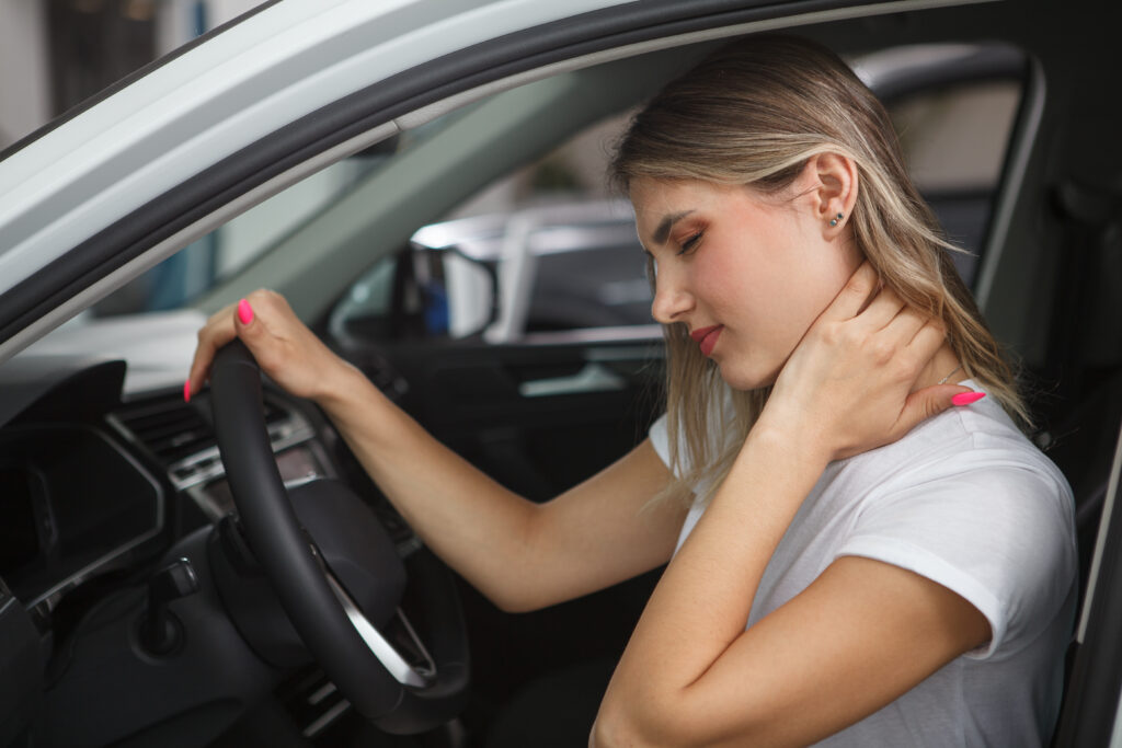 women suffering from neck pain after an accident