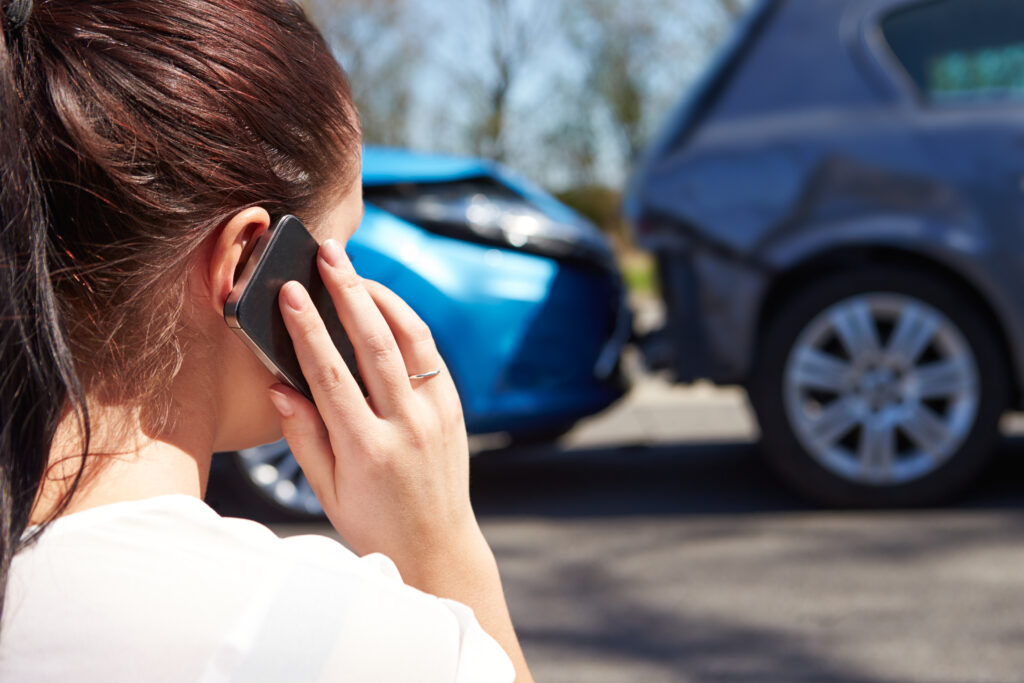 a women on the phone after a car accident