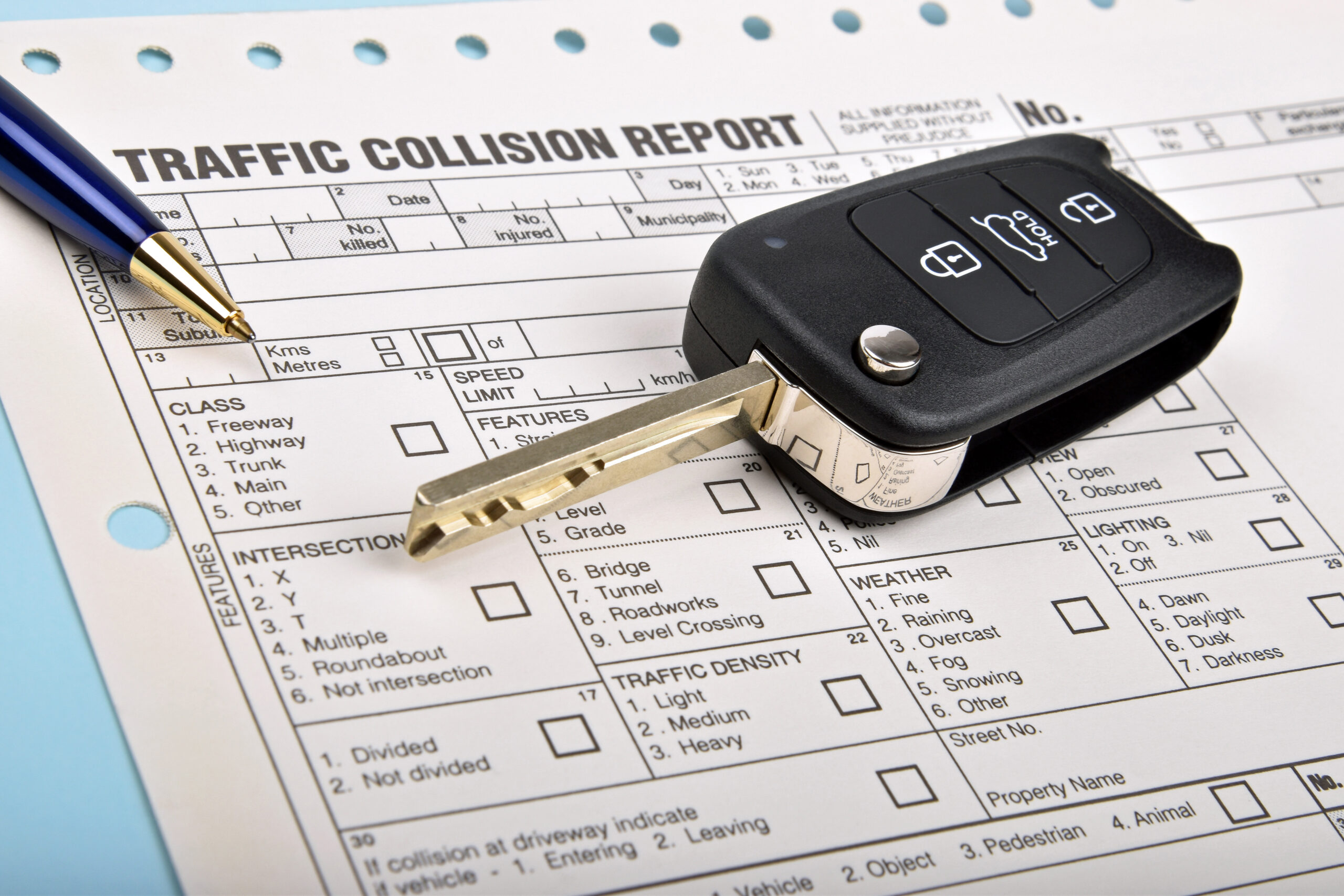 car key and crash report