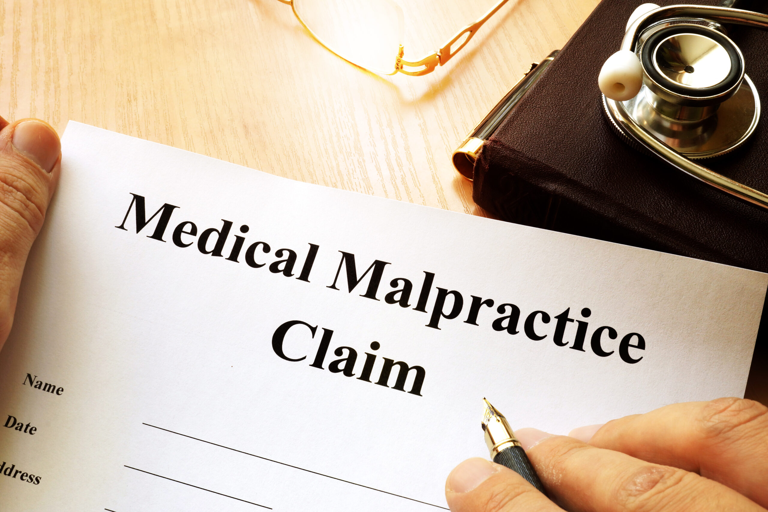 A blank, standard medical malpractice claim form. 