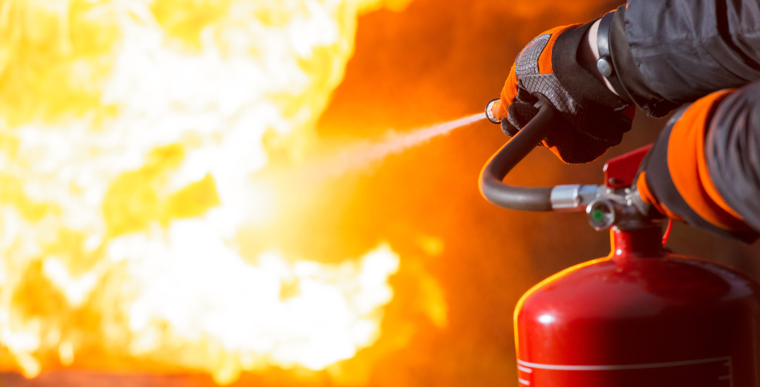 A fire extinguisher is used to battle a fire.